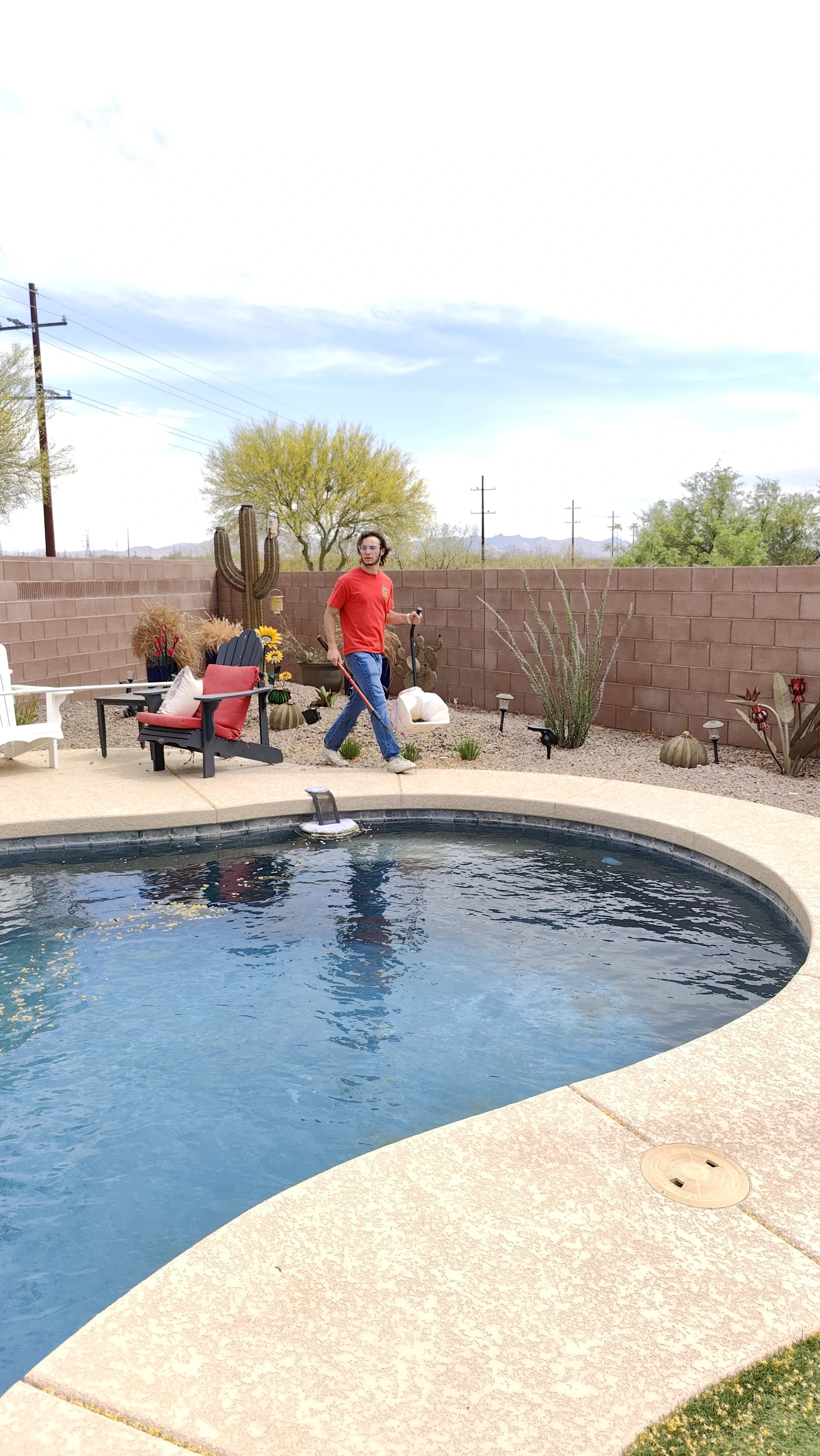 Scoop Doggy Logs team member performing twice-weekly yard cleanup