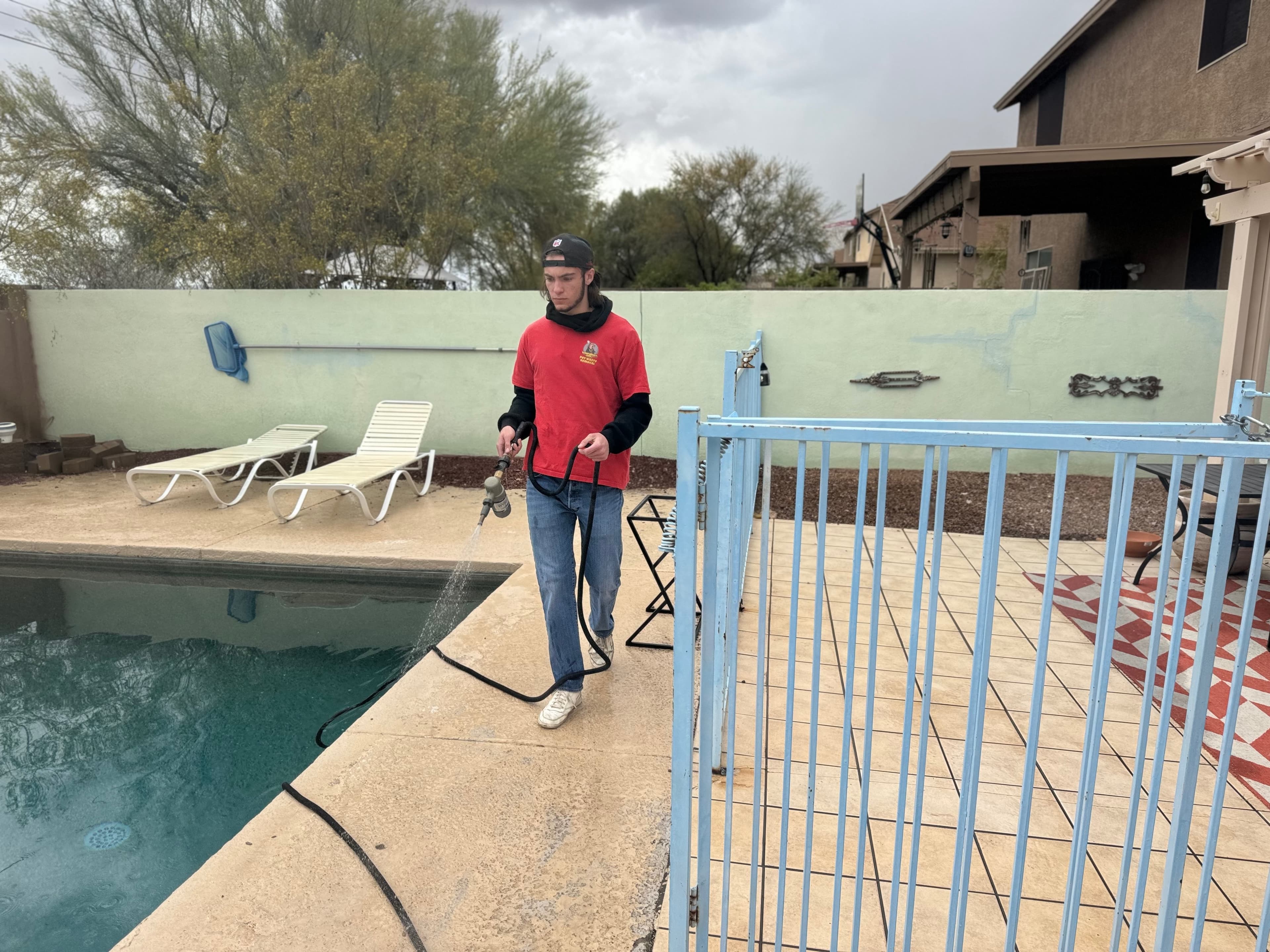 Scoop Doggy Logs team member working on a deodorizer route