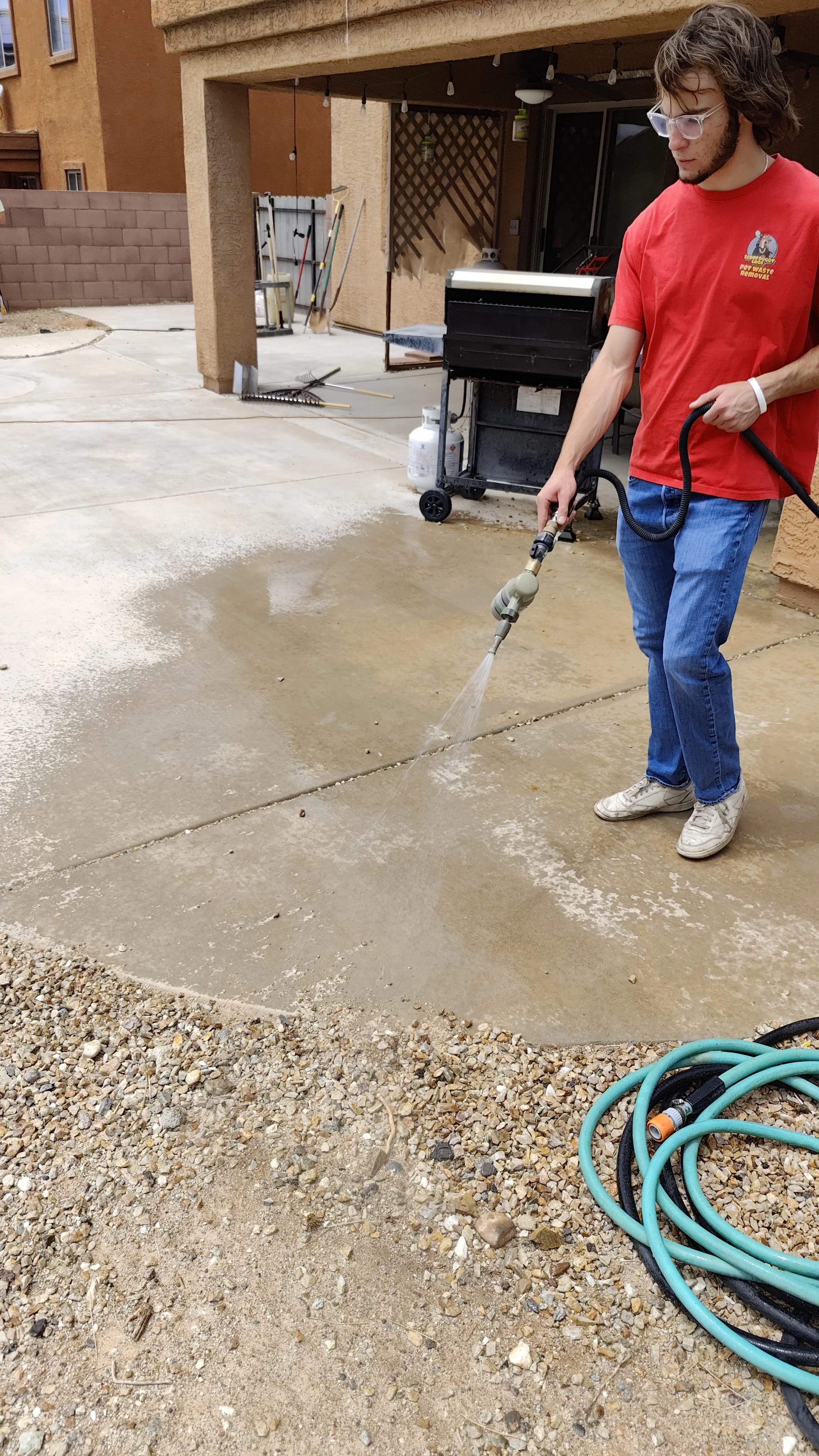 Scoop Doggy Logs team member applying yard treatment