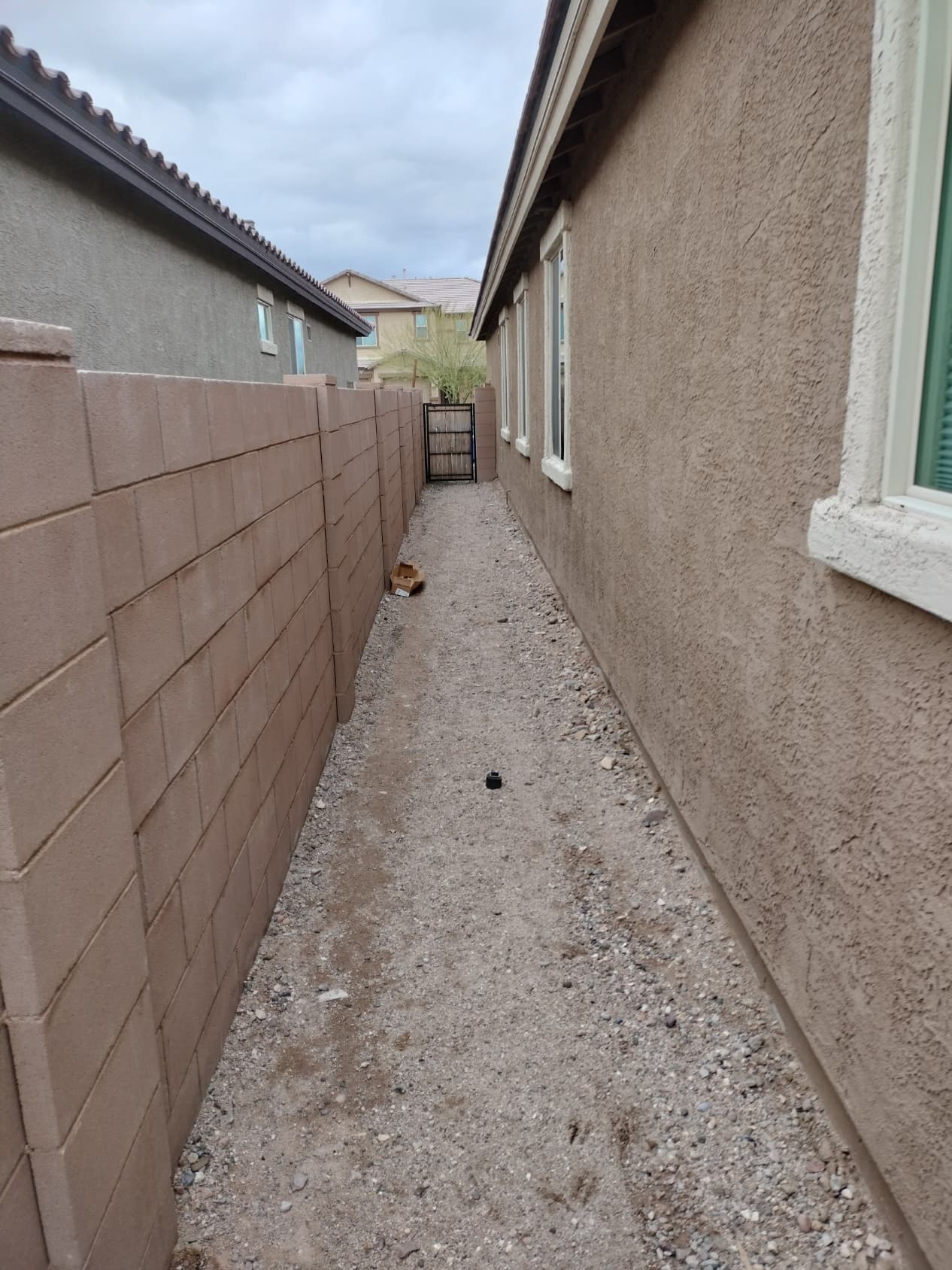 Desert yard with rock landscaping and turf section